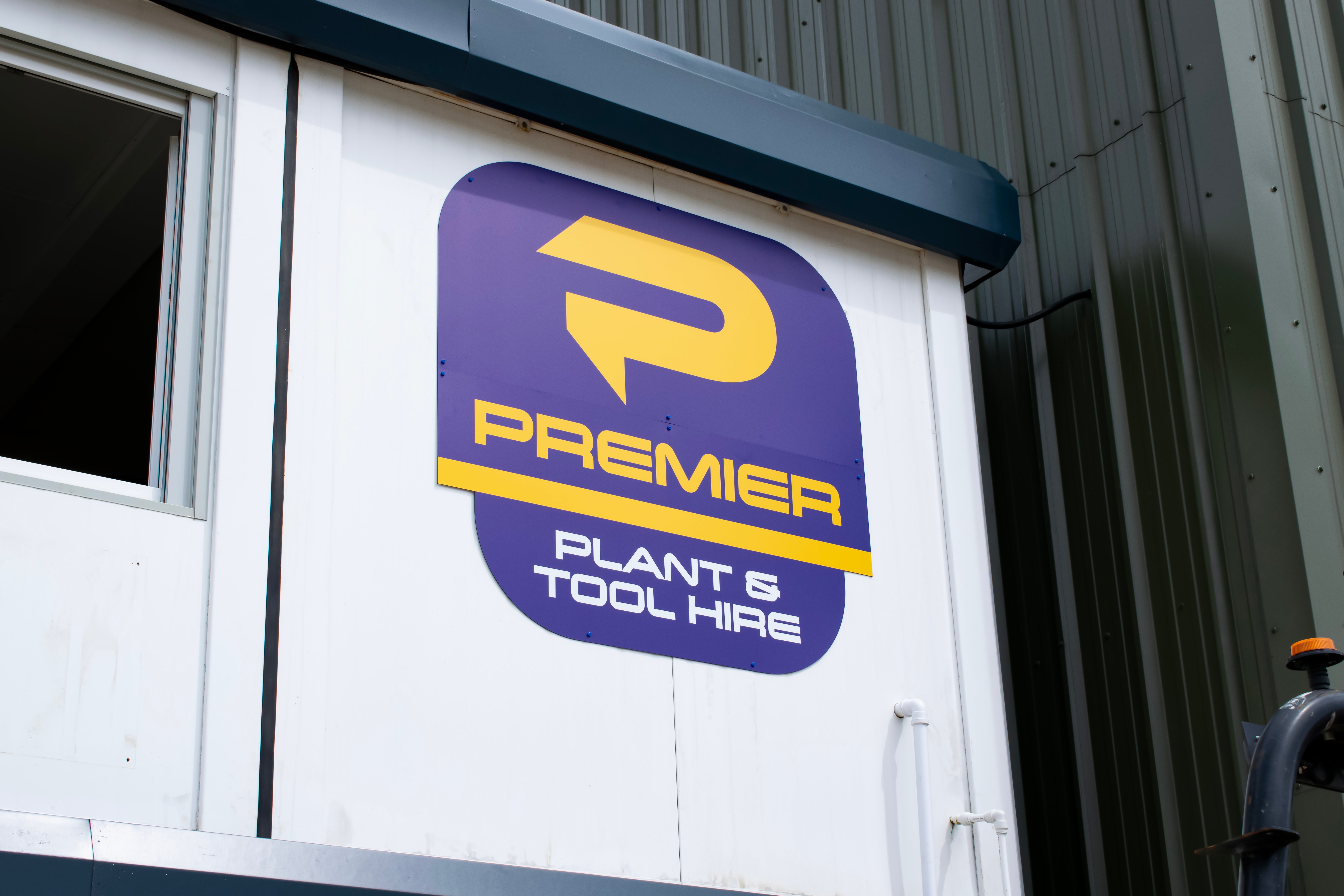 New Premier Plant branding on the side of a building